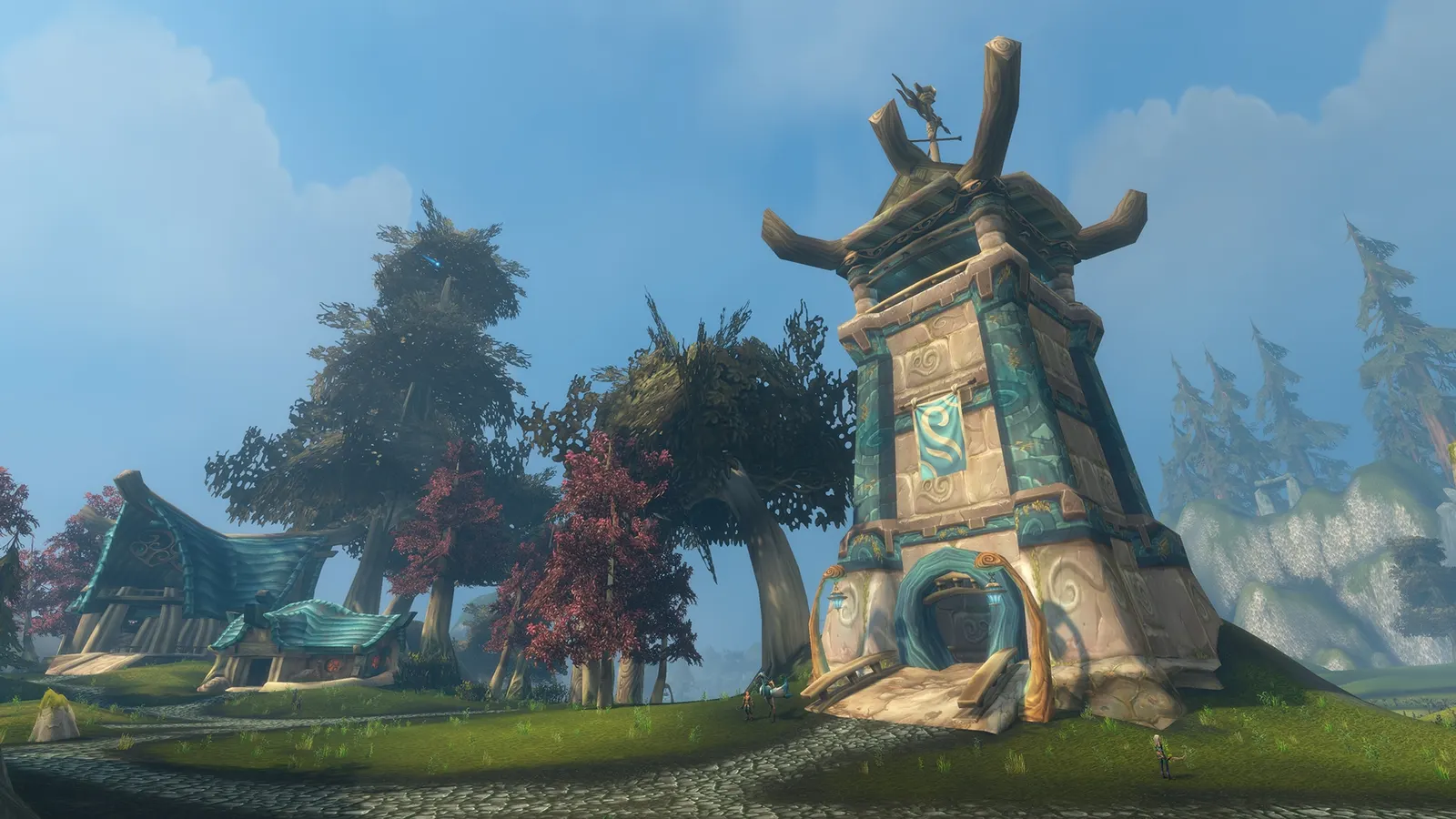 A tall Skyborne tower with a blue emblem beside cottages